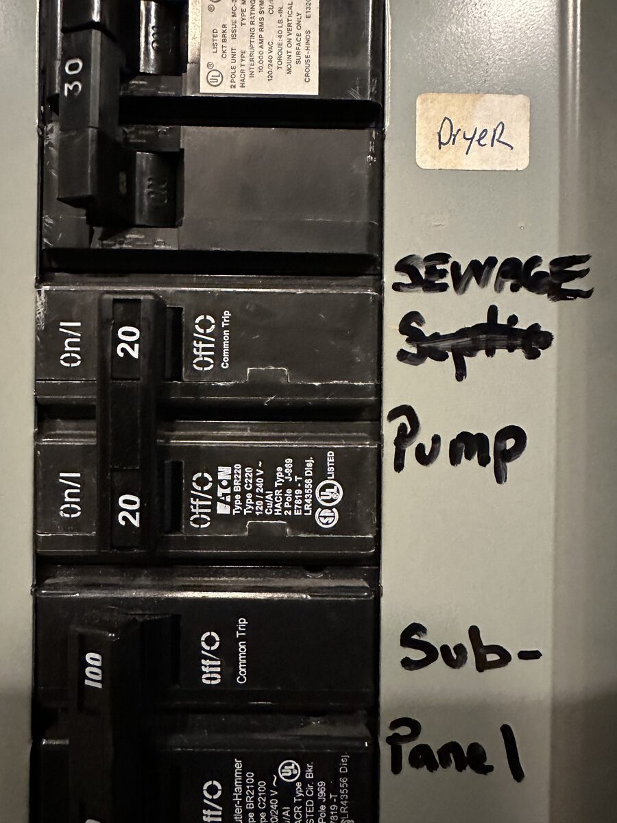 Failed septic pump control panel with red dome alarm light