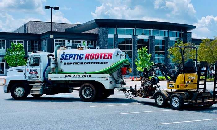 SepticRooter™ service truck and excavator on a septic repair job in Chamblee, Georgia